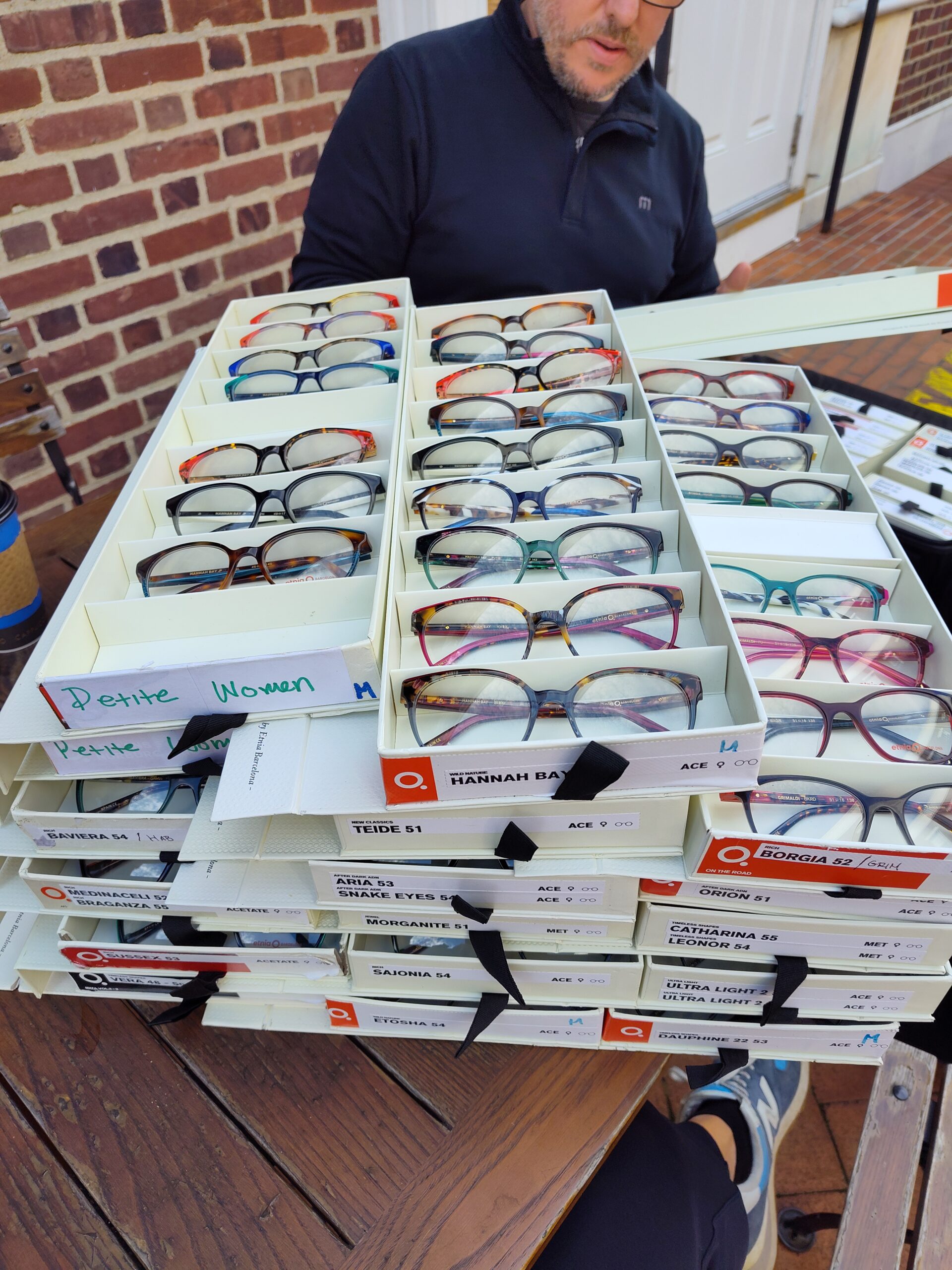 trays of colorful eyewear on display outdoors