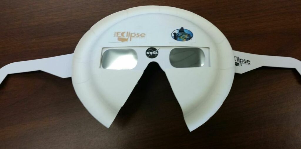 solar glasses taped to the inside of a paper plate